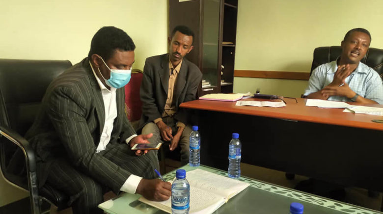 Axumite Abreha signing agreement for project